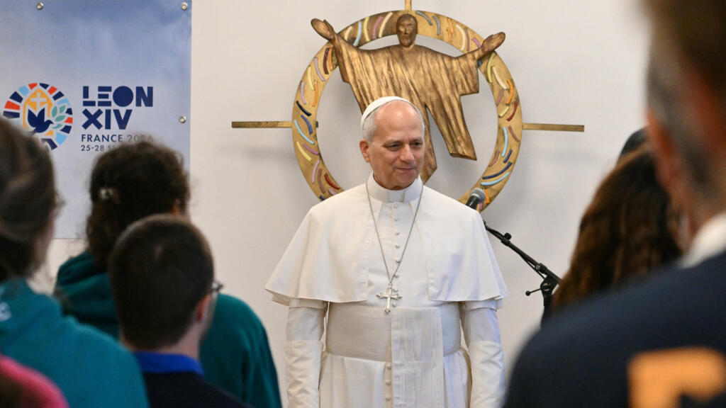 Live: Pope Leo visits migrant help centre on second day in Paris